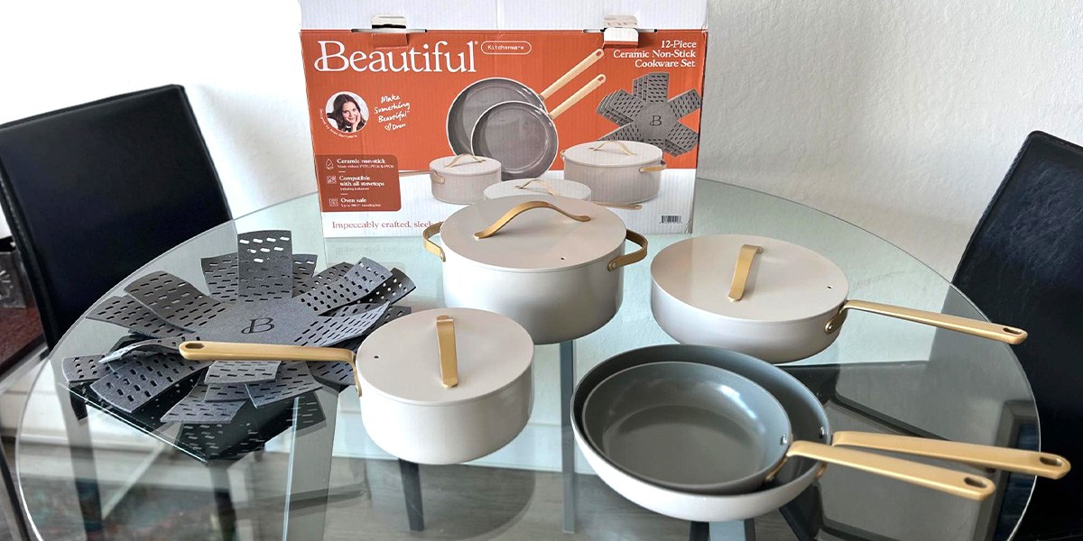 Beautiful by Drew Barrymore 12-Piece Nonstick Cookware Set on table in front of product box