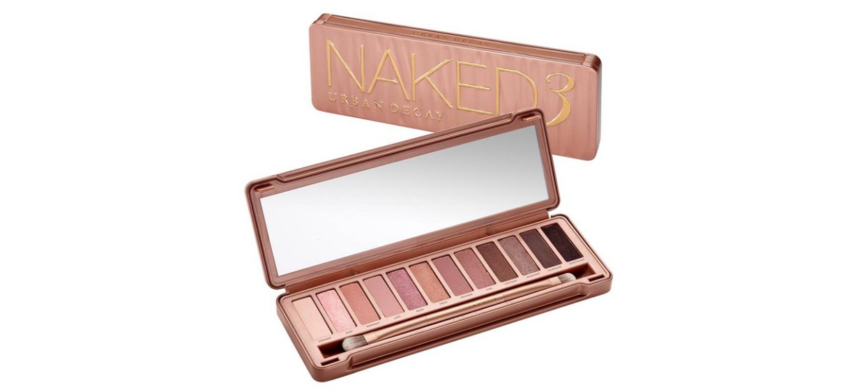 Open Pink Urban Decay Naked3 Eyeshadow Palette with closed version of the palette in the background