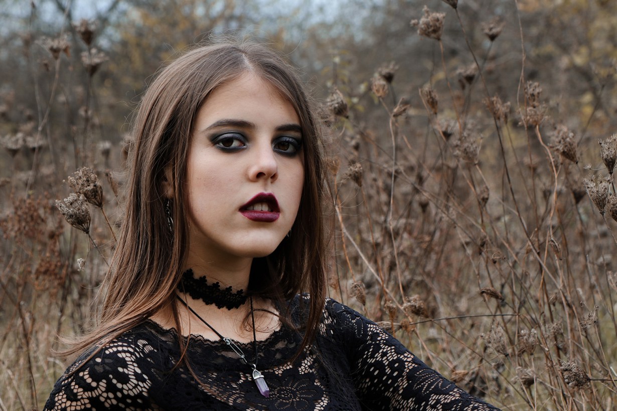 a woman with dark lipstick