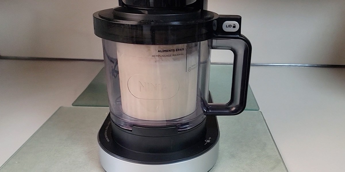 Ninja Creami Deluxe with vanilla ice cream inside