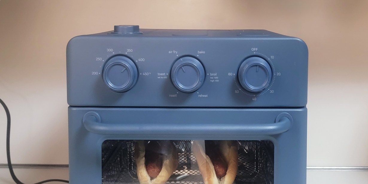 Blue Our Place Wonder Oven with hot dogs inside Blue Our Place Wonder Oven with hot dogs inside