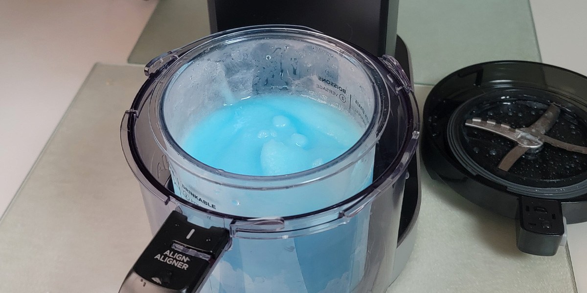 Ninja Creami Deluxe with blue slushie treat inside