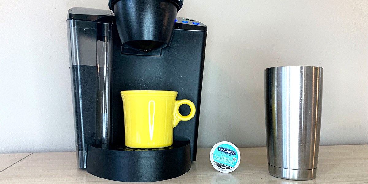 Keurig coffee maker on kitchen counter with yellow coffee cup