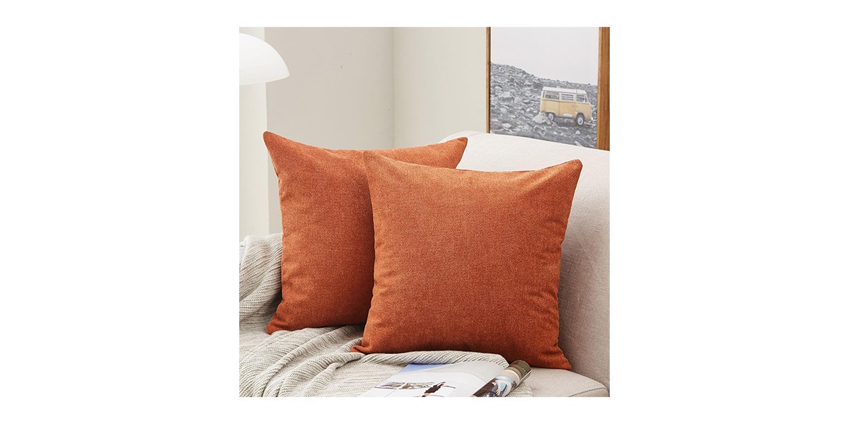 Two chenille orange throw pillows 