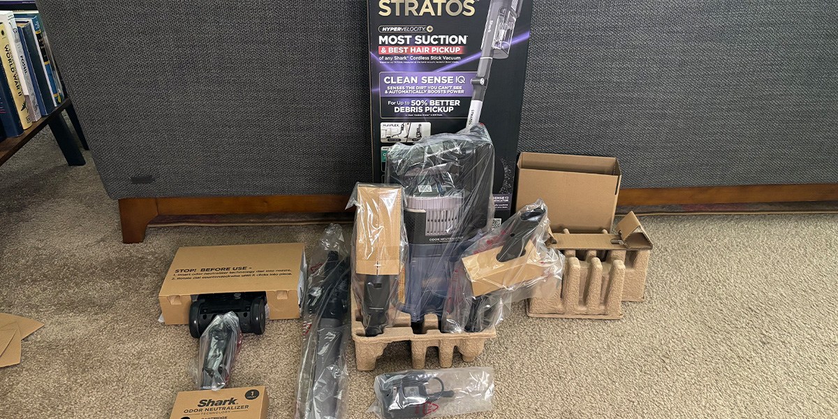 Shark Stratos Cordless in product packaging next to product box Shark Stratos Cordless in product packaging next to product box