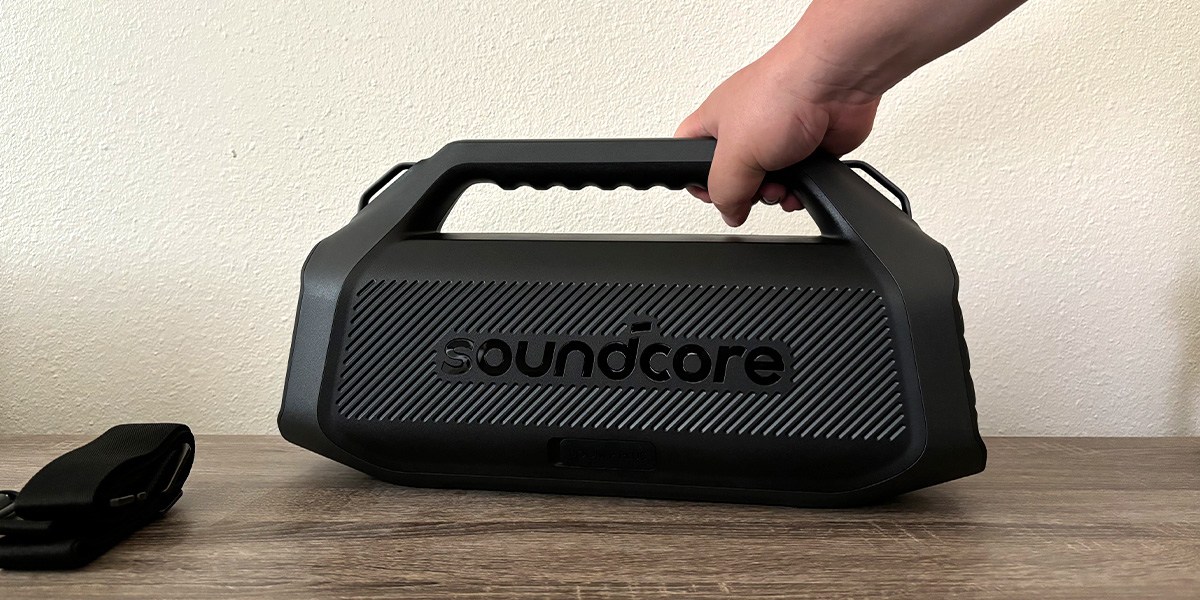 Hand holding Soundcore Boom 2 Plus Outdoor Speaker2 by handle