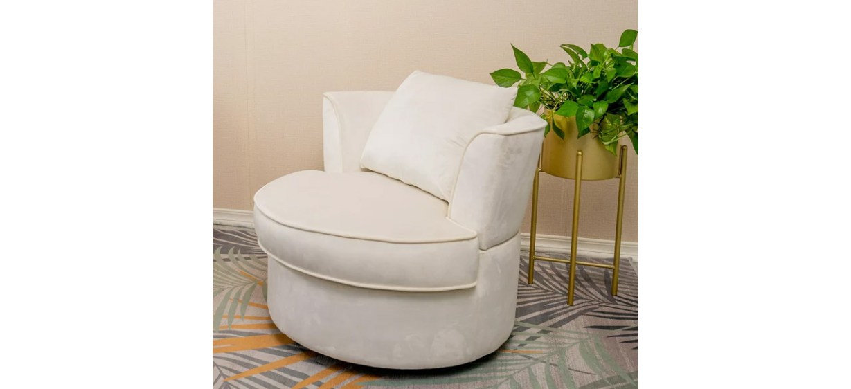 White Waytrim Velvet Swivel Barrel Chair next to planter