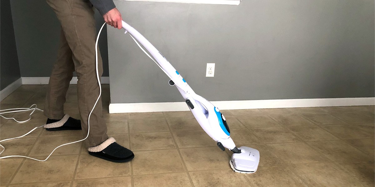 Person using PurSteam 10-in-1 Steam Mop on hard floor
