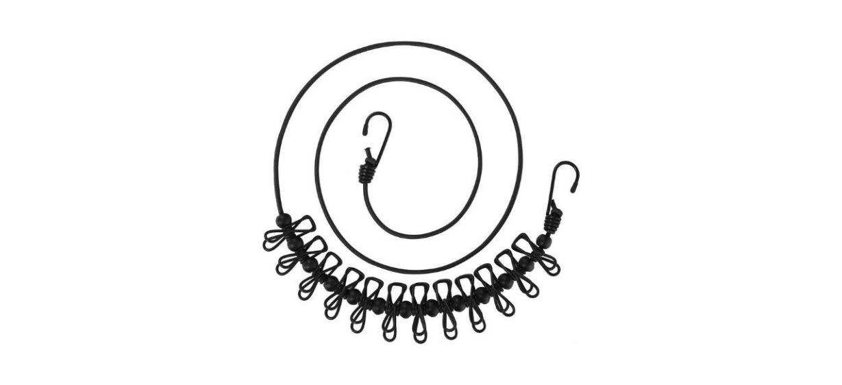Aikesiway Portable Travel Clothesline in black, coiled up into a circle shape
