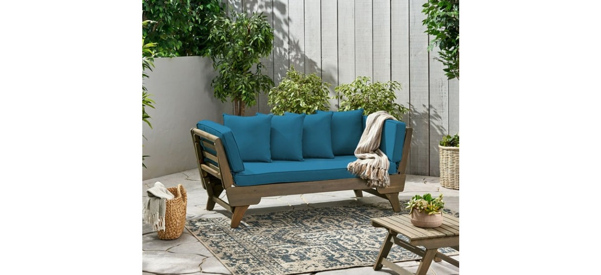 Turquoise GDF Studio Othello Outdoor Acacia Wood Expandable Daybed on patio