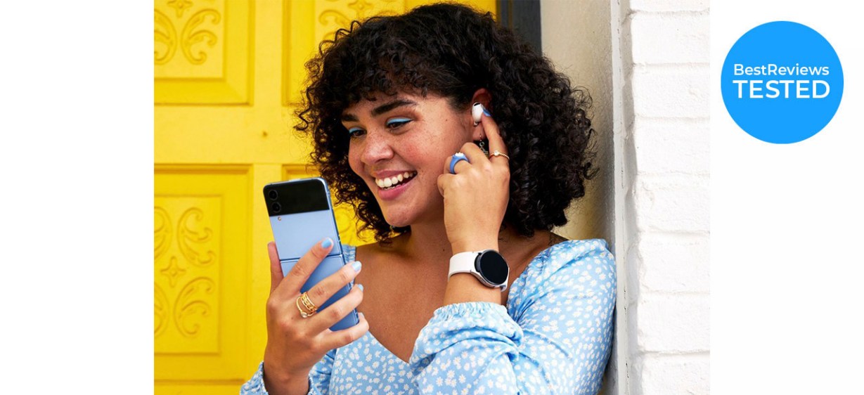 Woman using watch with phone