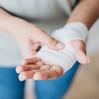 a hand wrapped in gauze